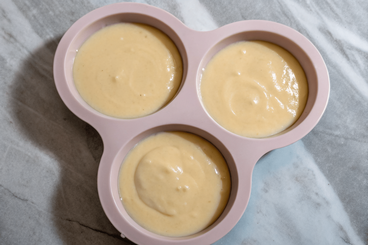 mini-bento-cake-batter-filled-mold Vanilla cake batter in pink silicone mold