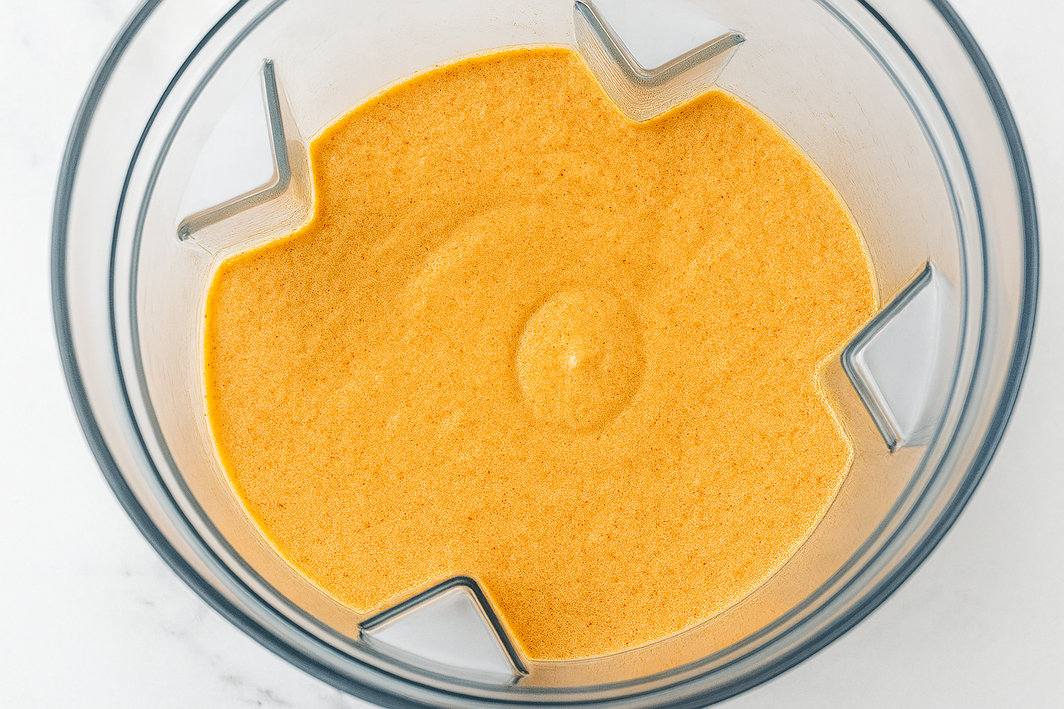 blending-cottage-cheese-queso Smooth blended cottage cheese queso in a blender