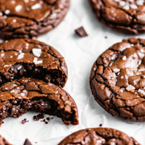 Brookies Recipe – Soft, Fudgy Brownie Cookies Brookies Recipe Fudgy brookies with crinkled tops and flaky salt on parchment paper