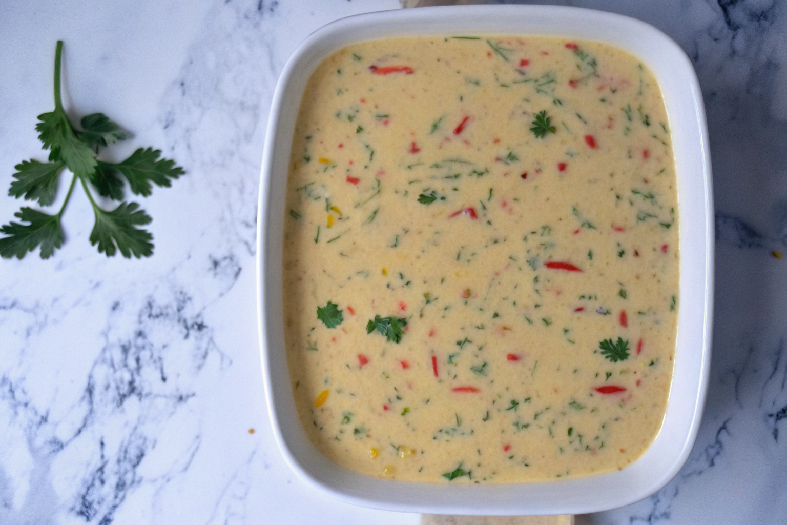 egg-mixture-in-casserole-dish Cottage cheese egg mixture poured into baking dish