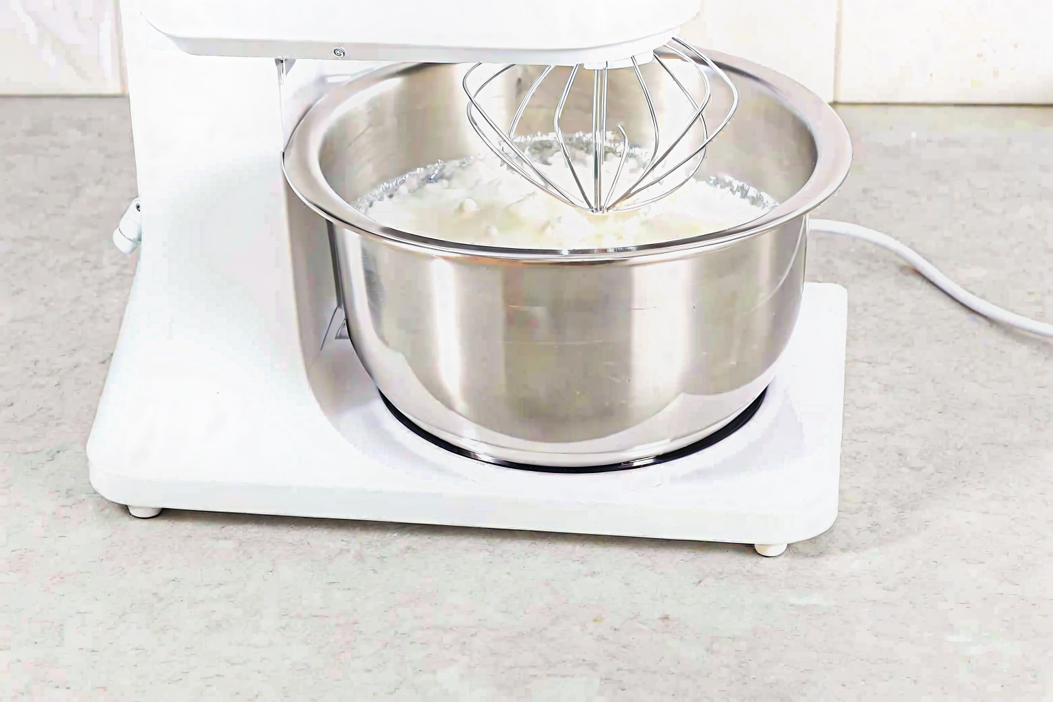folding-egg-whites-cloud-cake Folding egg whites into yolk mixture for cloud cake