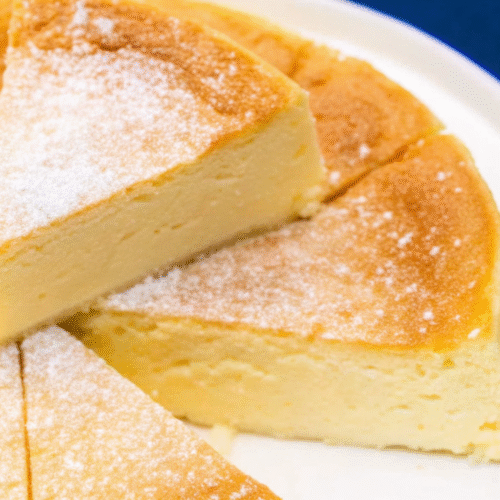 Cloud Cake Recipe – Soft, Fluffy & Easy Dessert You’ll Love cloud cake Fluffy baked cloud cake sliced on a white plate
