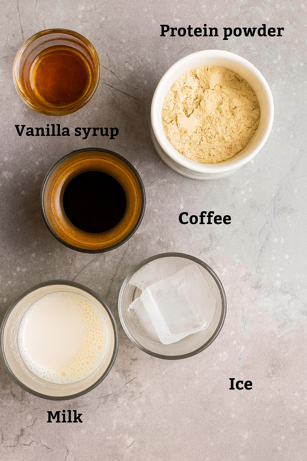 ingredient-protein-coffee-recipe Ingredients for protein coffee recipe including protein powder, vanilla, milk, coffee, and ice